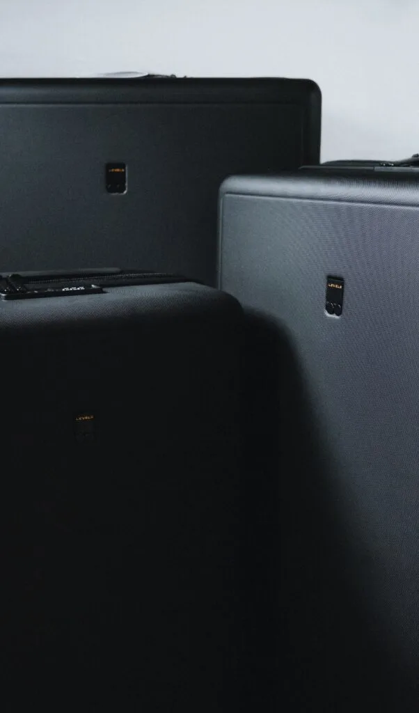 level 8 luminous textured luggage set review - are level 8 suitcases worth it - best suitcases for digital nomads - sturdy suitcases brands - best carry on suitcases - level 8 brand story - level 8 luggage review set - level 8 black suitcases