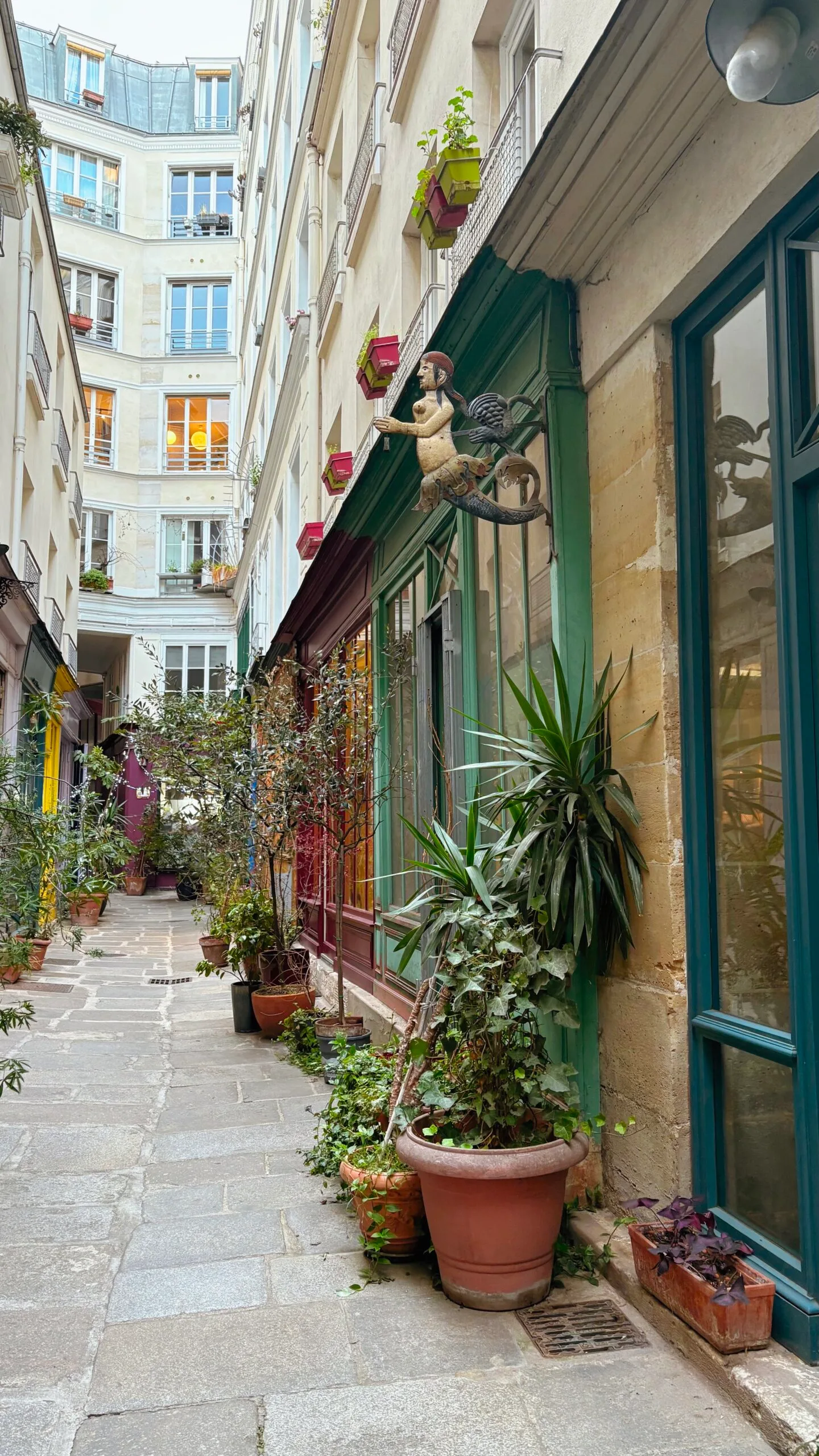 secret alleys in paris passage de l'ancre photos review - hidden villages in paris travel guide bucket list - best things to do in the spring in paris off the beaten path - colorful places in paris
